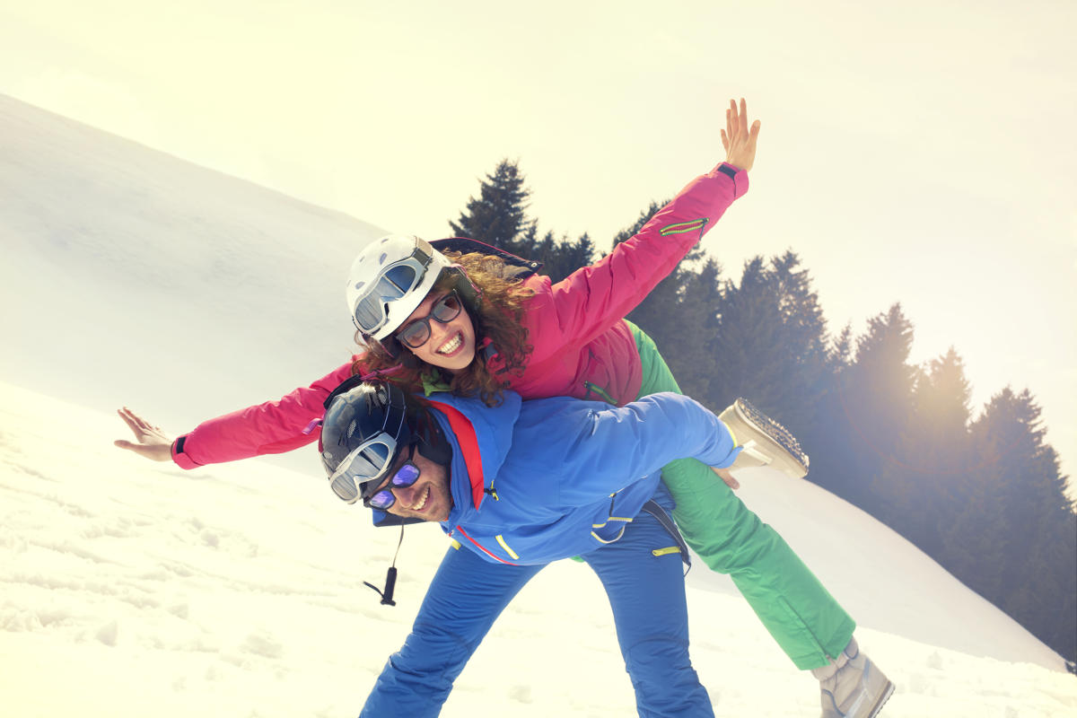 people snowboarding and using sunglasses to protect their eyes in the winter